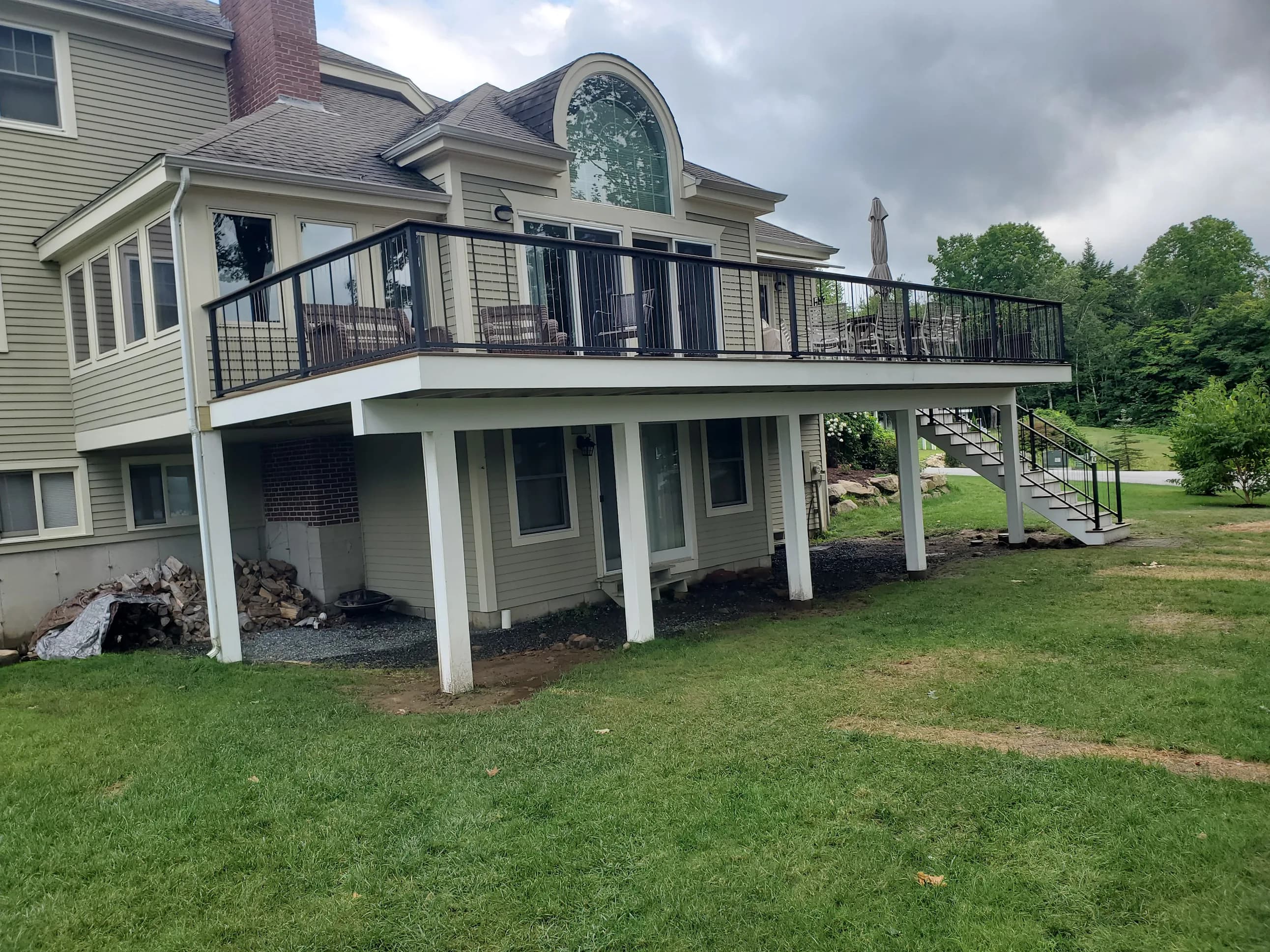 Elevated composite deck by A&E Home Improvement in Lakes Region, NH